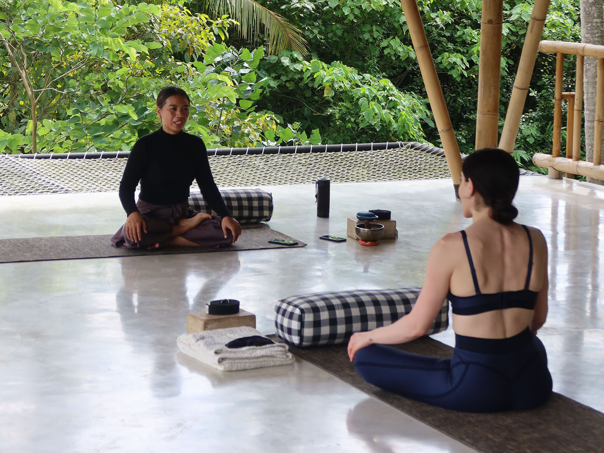 Women relaxing at a tropical Bali retreat with lush jungle surroundings